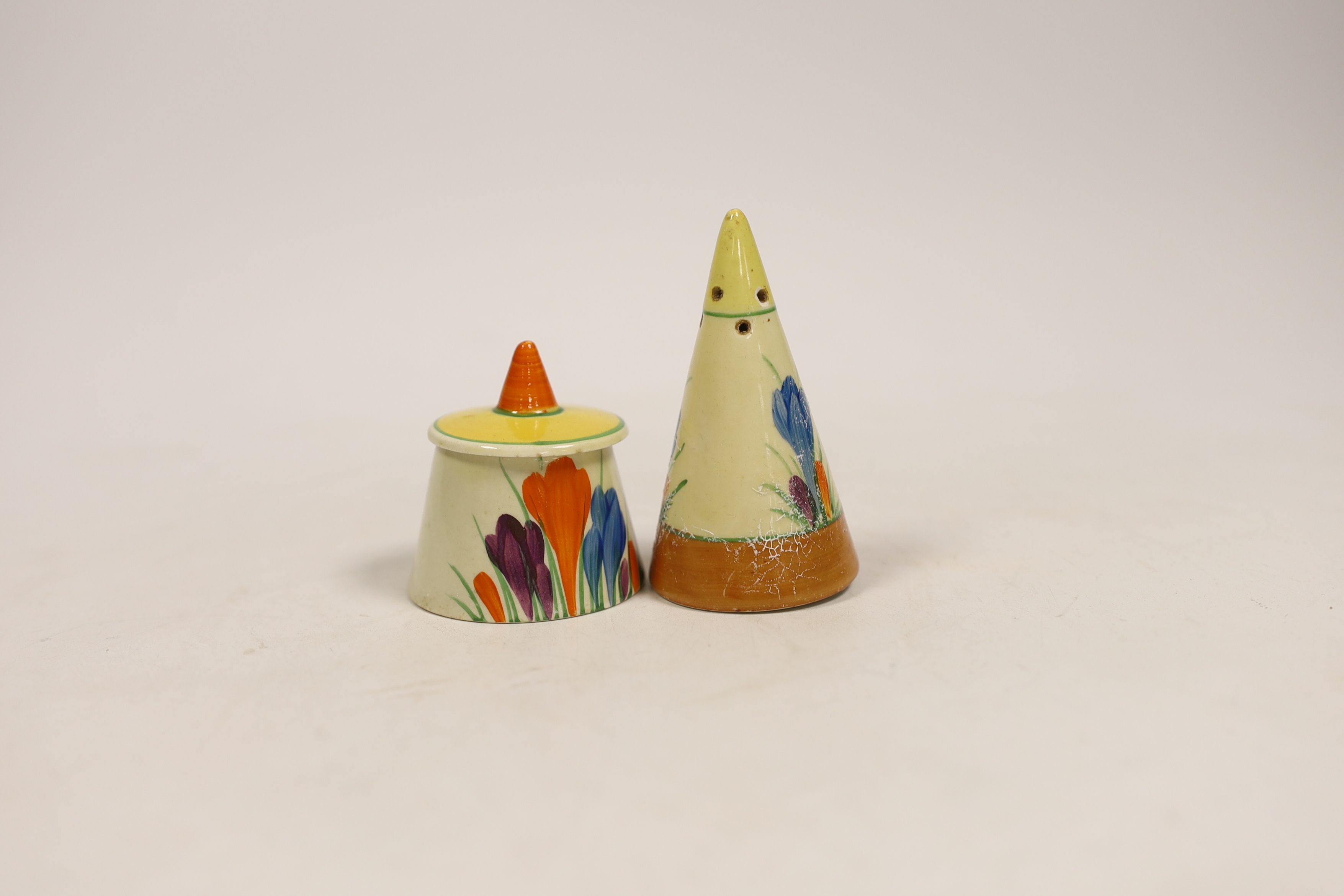 A Clarice Cliff crocus pattern mustard pot and pepper pot, largest 8cm high